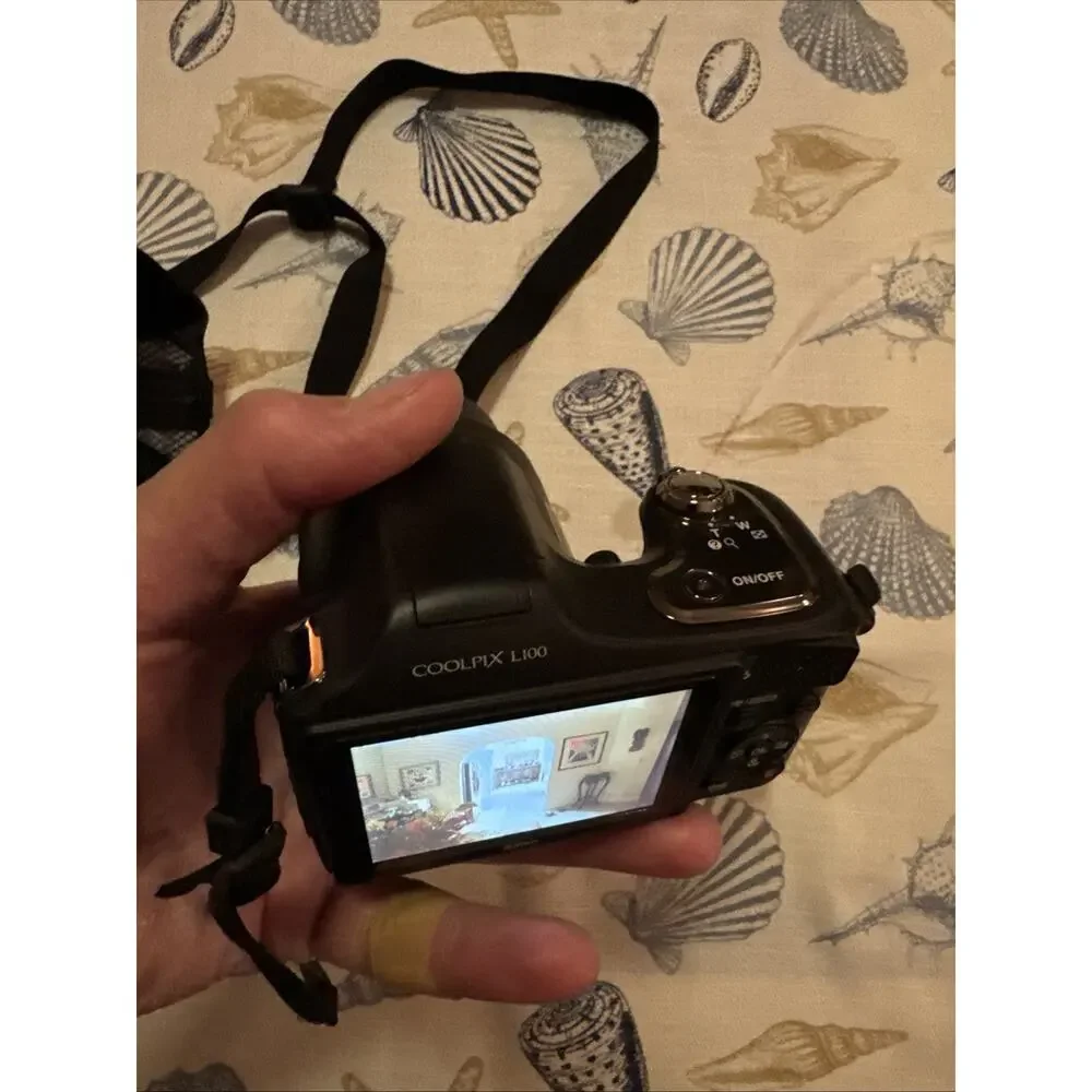 Nikon Black Camera with Matching Black Carry Case and Red Trim